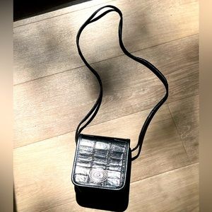 Vintage embossed black leather crossbody purse with concho detail